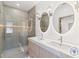 Spa-like bathroom with double vanity and a large shower at 9165 Golfview Ln, Covington, GA 30014