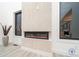 Modern linear fireplace with textured stone surround at 9165 Golfview Ln, Covington, GA 30014