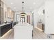 Modern kitchen with white quartz countertops and island at 9165 Golfview Ln, Covington, GA 30014