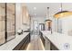 Sleek kitchen with glass-front cabinets and modern fixtures at 9165 Golfview Ln, Covington, GA 30014