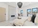 Main bedroom with modern fireplace and large windows at 9165 Golfview Ln, Covington, GA 30014