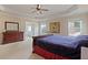 Bright bedroom showcasing neutral colors, a large bed, and an ensuite bathroom at 3130 Caney Creek Ln, Cumming, GA 30041