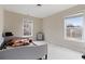 This bedroom is a blank canvas, featuring neutral walls, large windows, and space for a bed and desk at 3130 Caney Creek Ln, Cumming, GA 30041