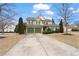 Charming two-story home featuring a two-car garage, manicured landscaping, and a welcoming entrance at 3130 Caney Creek Ln, Cumming, GA 30041