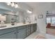 Double vanity bathroom with a walk-in shower and a view into the bedroom at 3346 Long Creek Dr, Buford, GA 30519