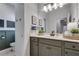 Modern bathroom with green vanity and built-in shelving at 3346 Long Creek Dr, Buford, GA 30519