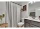 Clean bathroom with gray vanity and shower/tub combo at 3346 Long Creek Dr, Buford, GA 30519