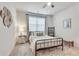 Cozy bedroom with metal bed frame and neutral decor at 3346 Long Creek Dr, Buford, GA 30519