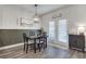 Bright dining room with French doors and stylish light fixture at 3346 Long Creek Dr, Buford, GA 30519