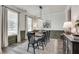 Dining room with dark wood table, black chairs, and green wainscoting at 3346 Long Creek Dr, Buford, GA 30519