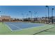 Well-lit tennis court with green and blue surface at 3346 Long Creek Dr, Buford, GA 30519