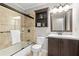 Updated bathroom with a tub shower combo and modern vanity at 730 Lake Forest Pass, Roswell, GA 30076