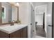 Basement bathroom with vanity and view to game room at 730 Lake Forest Pass, Roswell, GA 30076