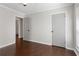 Bright bedroom with hardwood floors and neutral walls at 730 Lake Forest Pass, Roswell, GA 30076