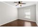 Bright bedroom with ceiling fan and dark wood floors at 730 Lake Forest Pass, Roswell, GA 30076