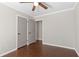 Spacious bedroom with double doors and dark wood flooring at 730 Lake Forest Pass, Roswell, GA 30076