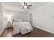 Bedroom with queen bed, ceiling fan and plenty of natural light at 730 Lake Forest Pass, Roswell, GA 30076