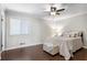 Spacious bedroom with a queen-size bed and ceiling fan at 730 Lake Forest Pass, Roswell, GA 30076