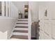 Inviting entryway with staircase and neutral color palette at 730 Lake Forest Pass, Roswell, GA 30076