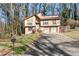 Two-story house with attached two-car garage and landscaped yard at 730 Lake Forest Pass, Roswell, GA 30076