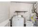 Convenient laundry room with washer, dryer, and shelving at 730 Lake Forest Pass, Roswell, GA 30076