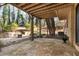 Stone patio with fire pit and stairs leading to the backyard at 730 Lake Forest Pass, Roswell, GA 30076