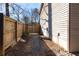 Gravel path and wooden fence leading to a gate at 730 Lake Forest Pass, Roswell, GA 30076