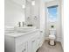 Contemporary bathroom with a vessel sink, tile flooring, and a window for natural light at 75 Boulevard Ne # 1, Atlanta, GA 30312