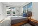 Sun-filled bedroom featuring a large window and platform bed with stylish side tables at 75 Boulevard Ne # 1, Atlanta, GA 30312