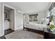 Bright bedroom features a modern, minimalist aesthetic, and the bedroom leads into a bathroom at 75 Boulevard Ne # 1, Atlanta, GA 30312