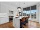 Modern kitchen with island, white cabinets, quartz countertops and city views at 75 Boulevard Ne # 1, Atlanta, GA 30312