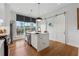 Chic kitchen with a waterfall island, stainless appliances, and a sliding barn door at 75 Boulevard Ne # 1, Atlanta, GA 30312