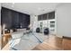 Elegant living room with contemporary furnishings and a sleek, dark accent wall at 75 Boulevard Ne # 1, Atlanta, GA 30312