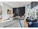 Bright and airy living room with modern decor, a large window and stylish furnishings at 75 Boulevard Ne # 1, Atlanta, GA 30312