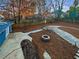 Landscaped backyard with firepit and paved walkways at 2781 Interlaken Dr, Marietta, GA 30062