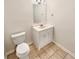 A half-bathroom with tiled floors includes a vanity and toilet in a neutral palette at 2781 Interlaken Dr, Marietta, GA 30062