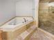 Bathroom features a large corner jacuzzi tub and walk-in shower at 2781 Interlaken Dr, Marietta, GA 30062