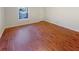 Bright bedroom featuring hardwood floors and a large window at 2781 Interlaken Dr, Marietta, GA 30062