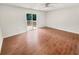 Bright bedroom featuring hardwood floors and a sliding glass door to a private deck at 2781 Interlaken Dr, Marietta, GA 30062