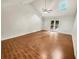 This living room boasts beautiful hardwood floors, a vaulted ceiling, and glass doors to the outdoors at 2781 Interlaken Dr, Marietta, GA 30062
