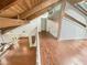 Open-concept layout with hardwood floors and exposed beams offers a spacious and inviting living space at 2781 Interlaken Dr, Marietta, GA 30062