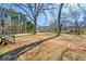 Spacious backyard with mature trees and large open area at 4443 Maroney Mill Rd, Douglasville, GA 30134