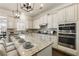 Bright kitchen with stainless appliances, granite island, and barstool seating at 4532 Summersweet Dr, Marietta, GA 30066