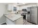 Modern kitchen featuring granite countertops and stainless steel appliances at 1025 Rock Creek Ln, Norcross, GA 30093