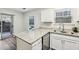 Kitchen with granite countertops, stainless steel appliances & access to patio at 1025 Rock Creek Ln, Norcross, GA 30093