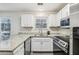 Kitchen with granite countertops and stainless steel appliances at 1025 Rock Creek Ln, Norcross, GA 30093