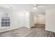 Living room with wood-look floors and access to other rooms at 1025 Rock Creek Ln, Norcross, GA 30093