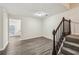 Living room with staircase and wood-look floors at 1025 Rock Creek Ln, Norcross, GA 30093