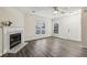 Living room with fireplace and wood-look floors at 1025 Rock Creek Ln, Norcross, GA 30093