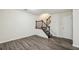 Living room with staircase and wood-look floors at 1025 Rock Creek Ln, Norcross, GA 30093